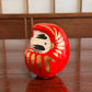 Daruma porte bonheur en papier mâché